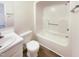 Bathroom featuring a shower and tub combination, a mirror, and modern fixtures at 27 Stonewall Way, Durham, NC 27704