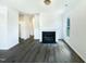Spacious living room with fireplace, hardwood floors, and plenty of natural light at 27 Stonewall Way, Durham, NC 27704