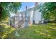 Backyard featuring a deck, grass, AC unit, and lattice under the deck at 29 Oak St, Roxboro, NC 27573