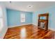 Bedroom with a fireplace and hardwood floors at 29 Oak St, Roxboro, NC 27573