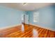 Bedroom with hardwood floors and a view into another room at 29 Oak St, Roxboro, NC 27573