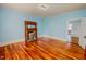 Bedroom with a fireplace and hardwood floors at 29 Oak St, Roxboro, NC 27573