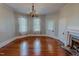 Dining room featuring hardwood floors, fireplace, and natural light at 29 Oak St, Roxboro, NC 27573