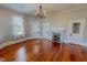 Dining room features hardwood floors, fireplace, and natural light at 29 Oak St, Roxboro, NC 27573