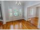 Inviting foyer with hardwood floors, stained glass door, and beautiful trim details at 29 Oak St, Roxboro, NC 27573