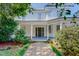 Beautiful two-story home with a classic porch, mature landscaping, and a welcoming entrance at 29 Oak St, Roxboro, NC 27573