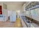 The kitchen features granite countertops and stainless steel sink at 29 Oak St, Roxboro, NC 27573