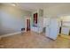 View of the kitchen with white appliances and open floor plan at 29 Oak St, Roxboro, NC 27573
