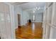 Elegant living room featuring hardwood floors, decorative fireplace, and beautiful entry doors at 29 Oak St, Roxboro, NC 27573