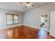 View of living room and bathroom featuring hardwood floors and natural light at 29 Oak St, Roxboro, NC 27573
