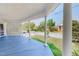 Relaxing covered porch offers a great outdoor space, ceiling fan, and backyard views at 29 Oak St, Roxboro, NC 27573