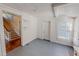 Bright room with whitewashed wood paneling and hardwood flooring at 29 Oak St, Roxboro, NC 27573