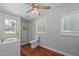 Bathroom with modern fixtures, glass enclosed shower, white vanity, and wood-look flooring at 301 Williamson St, Burlington, NC 27215