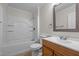 Bathroom featuring tub with shower, modern toilet, and vanity with sink at 301 Williamson St, Burlington, NC 27215