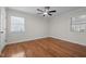 Bedroom with ceiling fan, hardwood floors and natural light from the windows at 301 Williamson St, Burlington, NC 27215