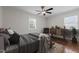 Staged bedroom features hardwood floors, ceiling fan, a window and stylish furniture at 301 Williamson St, Burlington, NC 27215
