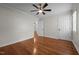 Bedroom with hardwood floors, ceiling fan, and neutral paint at 301 Williamson St, Burlington, NC 27215