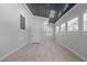 Spacious bonus room features painted wood ceiling, lots of windows and wood look flooring at 301 Williamson St, Burlington, NC 27215