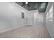 Bright bonus room features painted wood ceiling, lots of windows and wood look flooring at 301 Williamson St, Burlington, NC 27215
