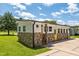 Ranch home featuring a decorative stone facade and bright yellow doors at 301 Williamson St, Burlington, NC 27215