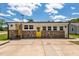 Ranch home featuring a decorative stone facade and bright yellow doors at 301 Williamson St, Burlington, NC 27215