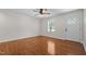 Living room with a large front window with natural light and hardwood floors at 301 Williamson St, Burlington, NC 27215
