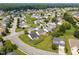 Aerial view of a residential neighborhood featuring well-maintained lawns and tree-lined streets at 302 Slate Dr, Gibsonville, NC 27249