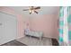 Charming bedroom with a bed, closet, soft pink walls and bright natural light at 302 Slate Dr, Gibsonville, NC 27249
