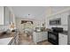 Bright kitchen with white cabinets, wooden countertops, stainless appliances, and breakfast nook at 302 Slate Dr, Gibsonville, NC 27249
