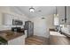 Well-lit kitchen with stainless steel appliances, wood countertops, and white cabinets at 302 Slate Dr, Gibsonville, NC 27249