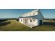 Stunning modern home with white siding, black trim, and a spacious covered porch overlooking scenic views at 345 Wake County Line Rd, Zebulon, NC 27597