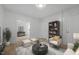 Cozy living room with modern furnishings, neutral decor, and ample natural light at 347 W Trade St, Burlington, NC 27217