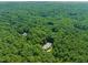 Aerial view of two homes nestled within a lush forest canopy, showcasing serene and private living at 3707 Stonegate Dr, Chapel Hill, NC 27516