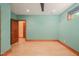 Well-lit bedroom showcasing hardwood floors, large windows, and a modern ceiling fan at 3707 Stonegate Dr, Chapel Hill, NC 27516