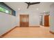 Spacious bedroom with natural light, neutral walls, wood flooring, and stylish doors at 3707 Stonegate Dr, Chapel Hill, NC 27516