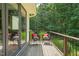 Relax on the outdoor deck with comfortable seating and beautiful views of the wooded yard at 3707 Stonegate Dr, Chapel Hill, NC 27516