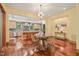 Dining room with hardwood floors adjacent to kitchen, lots of light, and an open concept at 3707 Stonegate Dr, Chapel Hill, NC 27516