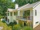 Rear exterior view of the home with a deck and lush backyard at 3707 Stonegate Dr, Chapel Hill, NC 27516