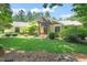 Attractive home exterior with a well-manicured lawn and a charming front entrance framed by lush greenery and stone accents at 3707 Stonegate Dr, Chapel Hill, NC 27516