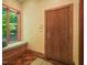 Inviting hallway with natural light from window seat and convenient door access to the exterior at 3707 Stonegate Dr, Chapel Hill, NC 27516