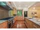Large kitchen features stainless appliances, granite countertops, and ample cabinetry at 3707 Stonegate Dr, Chapel Hill, NC 27516