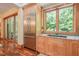 Gourmet kitchen area with stainless fridge, granite countertops, and sliding door to outside at 3707 Stonegate Dr, Chapel Hill, NC 27516