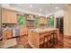 Well-appointed kitchen with stainless appliances, custom cabinets, and granite countertops at 3707 Stonegate Dr, Chapel Hill, NC 27516