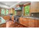 Large, open kitchen with granite counters, stainless appliances, and hardwood floors at 3707 Stonegate Dr, Chapel Hill, NC 27516