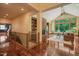 Open-concept living room with hardwood floors, large windows, and a cozy fireplace, offering a bright and inviting atmosphere at 3707 Stonegate Dr, Chapel Hill, NC 27516