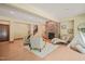 Comfortable living room featuring stone fireplace, cozy seating, and a modern teepee with natural light at 3707 Stonegate Dr, Chapel Hill, NC 27516