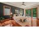 Spacious main bedroom with a balcony, dark accent wall, and an abundance of natural light at 3707 Stonegate Dr, Chapel Hill, NC 27516