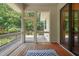 View of the screened in porch with wood flooring and access to the backyard at 3707 Stonegate Dr, Chapel Hill, NC 27516