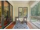 Cozy porch with comfortable seating, wooden floors, and picturesque views of the surrounding nature at 3707 Stonegate Dr, Chapel Hill, NC 27516