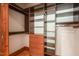 Custom walk-in closet featuring built-in shelving and drawers for optimal storage solutions at 3707 Stonegate Dr, Chapel Hill, NC 27516